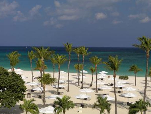 The dance of the beach umbrellas and lounge chairs